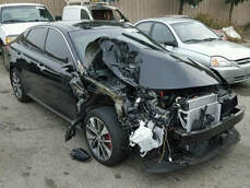 damaged black car after car accident